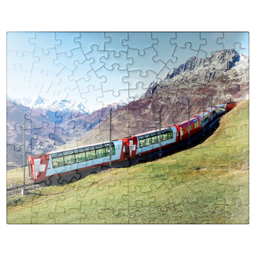 puzzleplate An express with panoramic windows overlooking the meadows on the mountains and snow-capped mountains under blue sunny sky in Andermatt, Uri, Switzerland 100 Jigsaw Puzzle