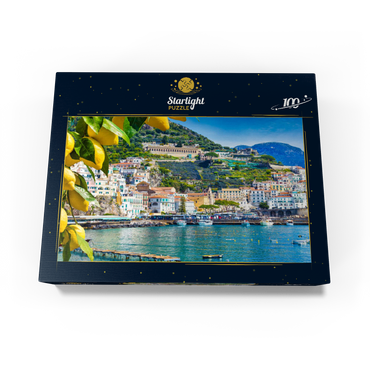Panoramic view of beautiful Amalfi on hills leading down to the coast, Campania, Italy. Amalfi Coast is the most popular travel and vacation destination in Europe. Ripe yellow lemons in the foreground. 100 Jigsaw Puzzle box view1