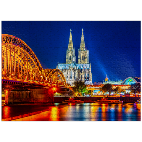 puzzleplate Night view of Cologne Cathedral and Hohenzollern Bridge over Rhine, Germany 300 Jigsaw Puzzle