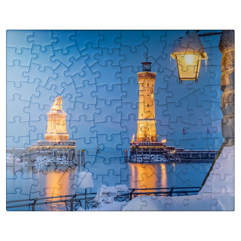 puzzleplate Harbour entrance with lighthouse and lion statue on a winter evening, Lindau 100 Jigsaw Puzzle