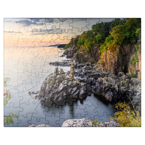 puzzleplate Sunrise at Helligdomsklipperne, a rocky coast north of Gudhjem 100 Jigsaw Puzzle