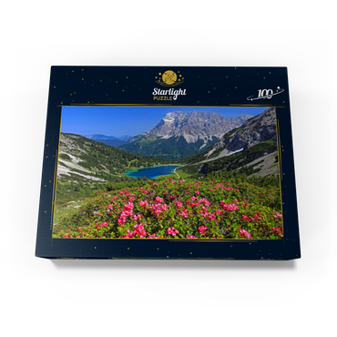 Blooming alpine roses at the Coburger hut against Seebensee (1657m) and Zugspitzgruppe (2962m) near Ehrwald 100 Jigsaw Puzzle box view1