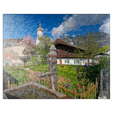 puzzleplate Polznkasparhaus with church St. Martin at Mohrenplatz in Garmisch-Partenkirchen 100 Jigsaw Puzzle