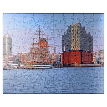 puzzleplate Sailing ship Amerigo Vespucci at the Überseebrücke in the harbor with Elbphilharmonie in the HafenCity, Hamburg 100 Jigsaw Puzzle