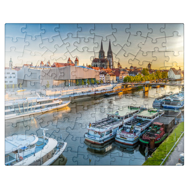 puzzleplate Museum of Bavarian History on the banks of the Danube with Regensburg Cathedral in the evening 100 Jigsaw Puzzle