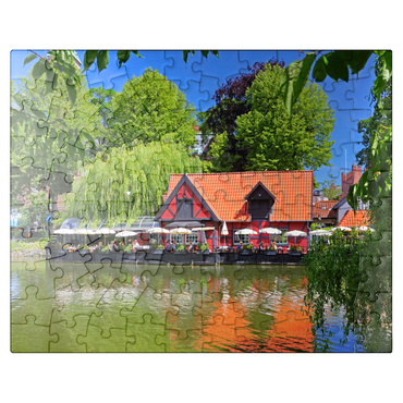 puzzleplate Small pond with restaurant Faergekroen in amusement park Tivoli 100 Jigsaw Puzzle