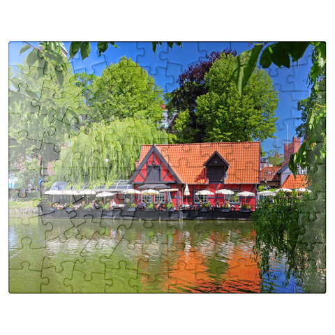 puzzleplate Small pond with restaurant Faergekroen in amusement park Tivoli 100 Jigsaw Puzzle