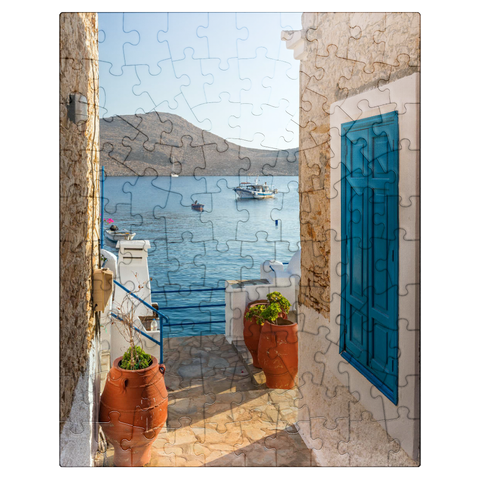 puzzleplate Alley with view to the sea in the morning, Emborios harbor village, Chalki island, Dodecanese, Greece 100 Jigsaw Puzzle