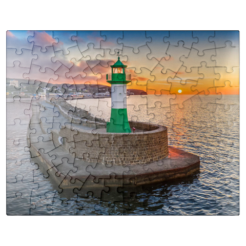 puzzleplate Lighthouse at sunrise at the pier, east pier at the entrance to the city harbor 100 Jigsaw Puzzle