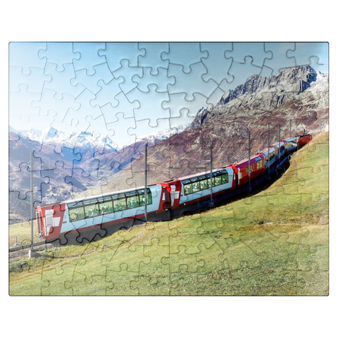 puzzleplate An express with panoramic windows overlooking the meadows on the mountains and snow-capped mountains under blue sunny sky in Andermatt, Uri, Switzerland 100 Jigsaw Puzzle