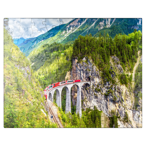 puzzleplate Glacier Express on the Landwasser Viaduct, Switzerland, the landmark of the Swiss Alps. The red Bernina train runs on the railroad bridge in the mountains. Aerial view of the railroad in summer. Beautiful alpine scenery 100 Jigsaw Puzzle