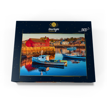 Rockport Harbor in Massachusetts with its lobster boats and village reflect in the still waters of the day. The colors give the town a nostalgic feel. 500 Jigsaw Puzzle box view1