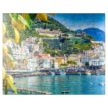 puzzleplate Panoramic view of beautiful Amalfi on hills leading down to the coast, Campania, Italy. Amalfi Coast is the most popular travel and vacation destination in Europe. Ripe yellow lemons in the foreground. 100 Jigsaw Puzzle