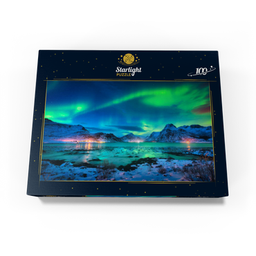 Aurora borealis over sea coast, snow covered mountains and city lights at night. Northern lights on Lofoten Islands, Norway. Starry sky with aurora borealis. Winter landscape with aurora reflected in water. 100 Jigsaw Puzzle box view1