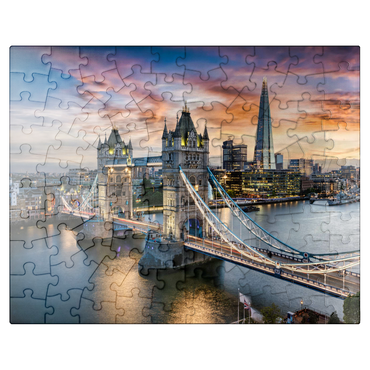 puzzleplate Aerial view to illuminated Tower Bridge and skyline of London, Great Britain, shortly after sunset 100 Jigsaw Puzzle