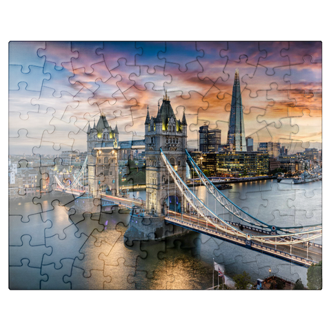 puzzleplate Aerial view to illuminated Tower Bridge and skyline of London, Great Britain, shortly after sunset 100 Jigsaw Puzzle