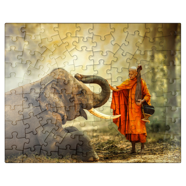 puzzleplate Monk hiking with the fancy elephant in the forest. 100 Jigsaw Puzzle